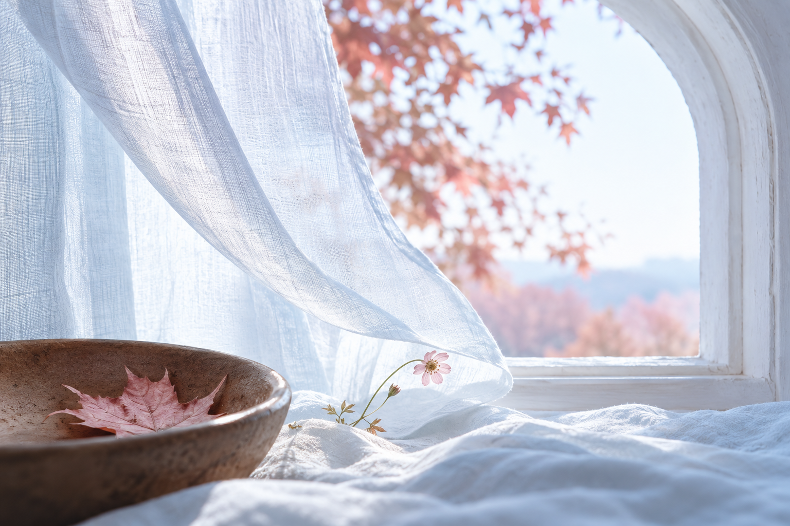 An imagined autumn moment: pale blue-white linen at an arched window, a pink maple leaf in a cocoa-brown bowl.